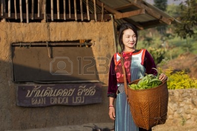 13686118-maehongson-thailand--feb-12--earthen-house-village--lisu-hill-tribe-girl-in-traditional-costume-with.jpg